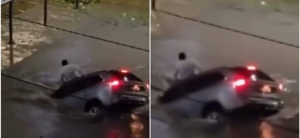 Homem sobe no teto do carro para escapar de forte correnteza no interior da Bahia